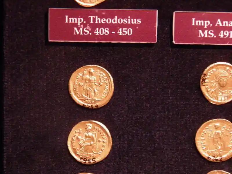 Crosses and stars engraved on coins during the time of emperor Theodosius II and Anastacius, dated 408-450.